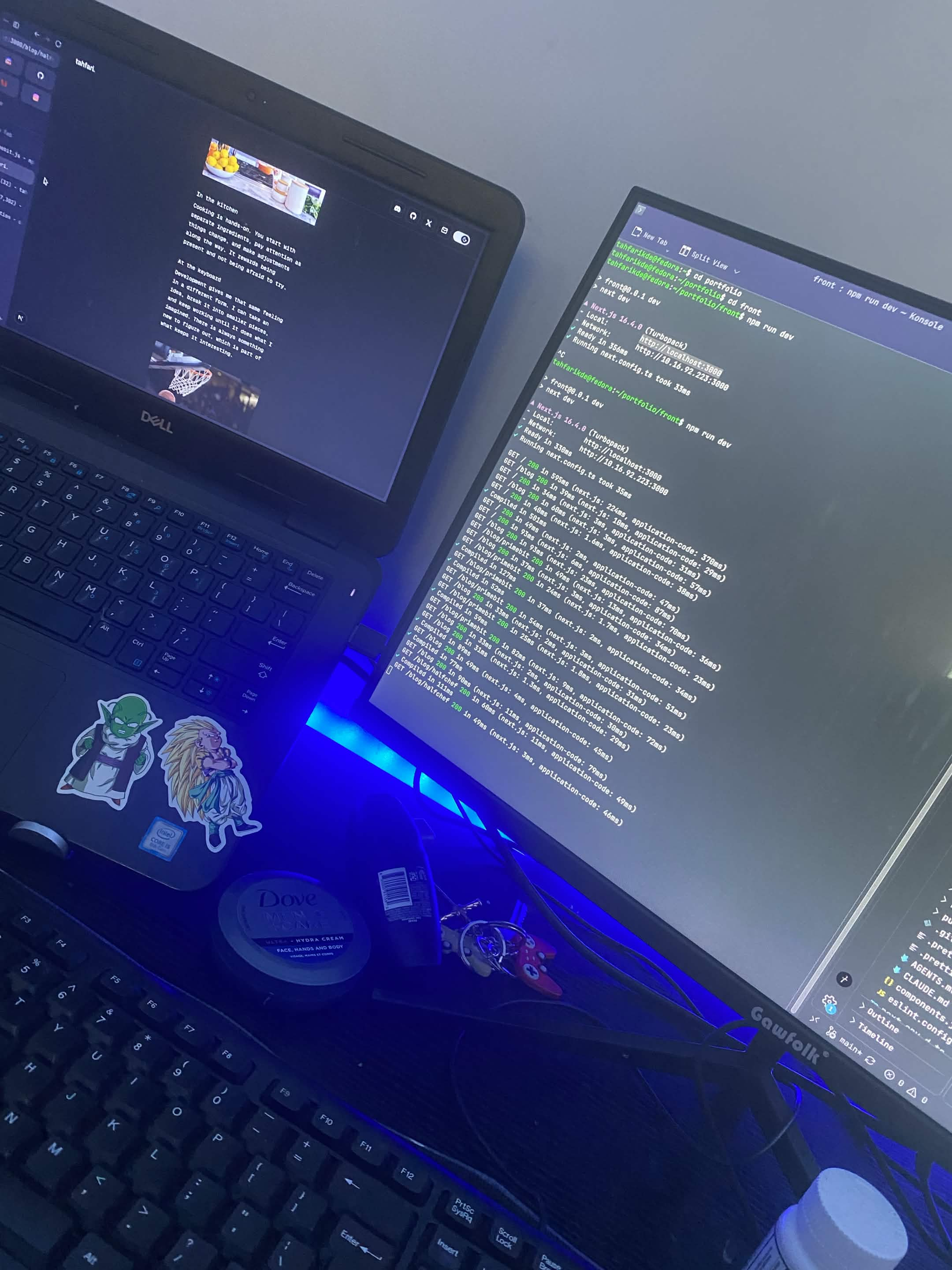 A laptop and monitor displaying a coding project.